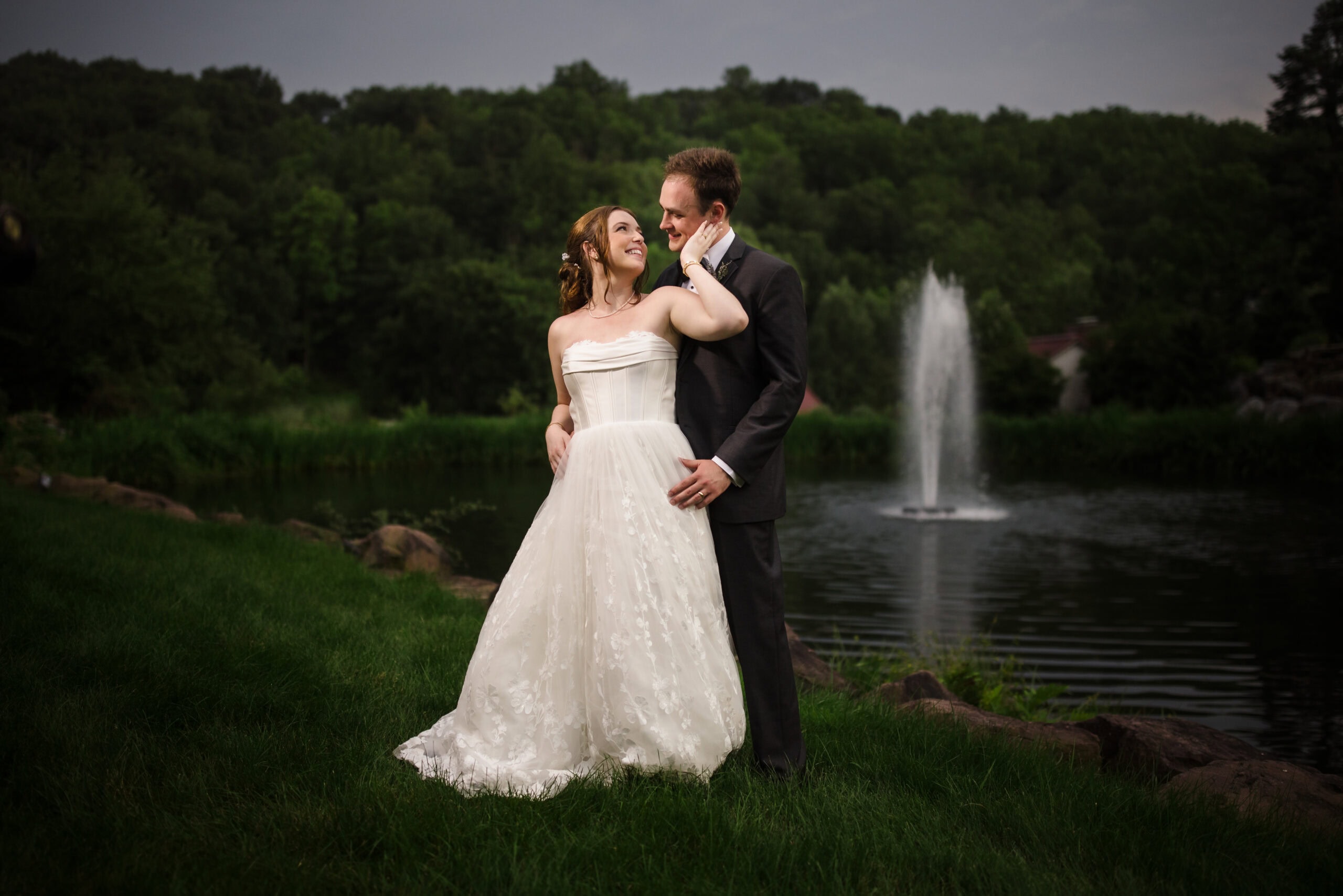 A couple enjoying a private moment by a water fountain
