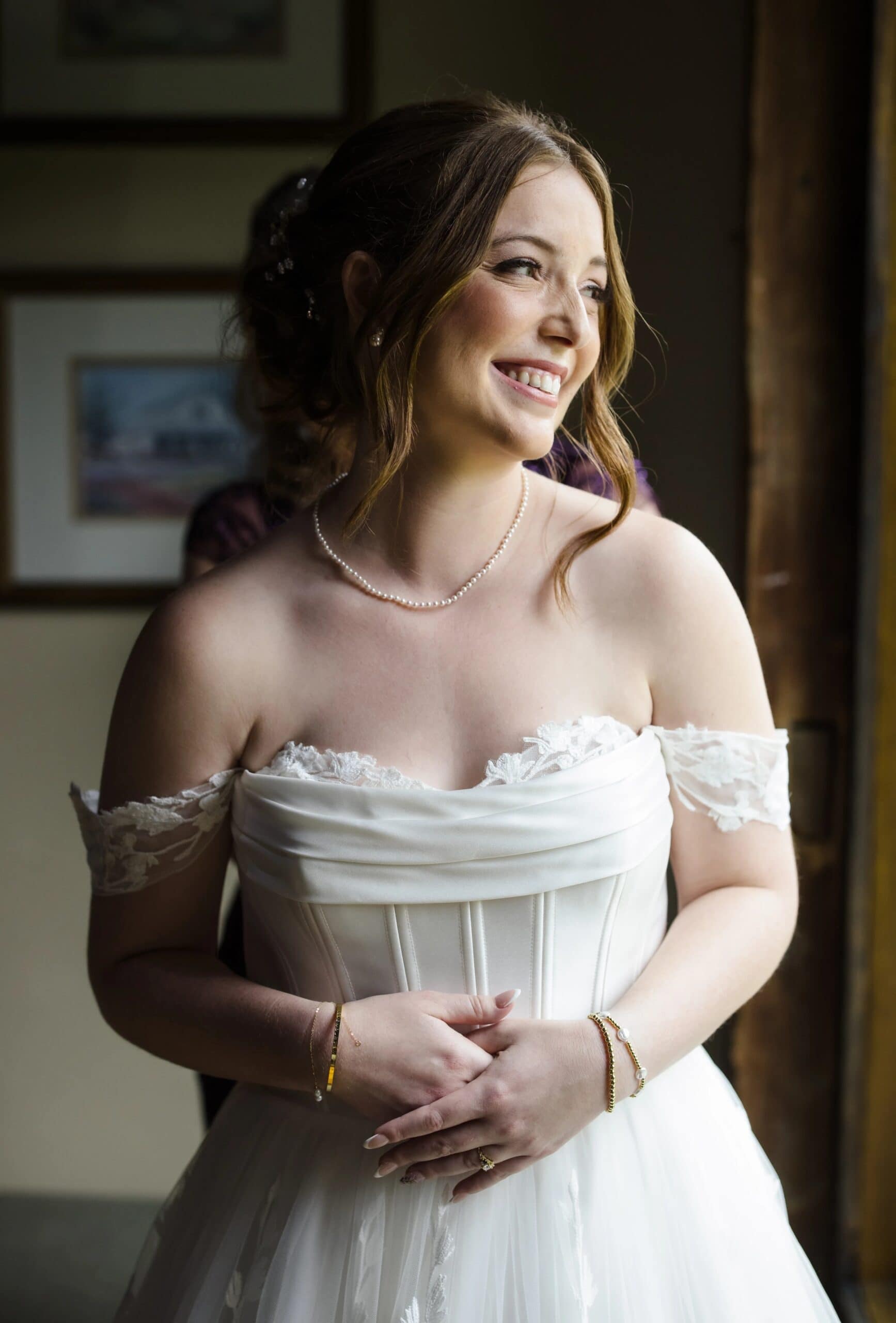 Bride in wedding dress gazing thoughtfully to the side, holding her bouquet. — Wedding at Glasbern Inn, Fogelsville, PA
