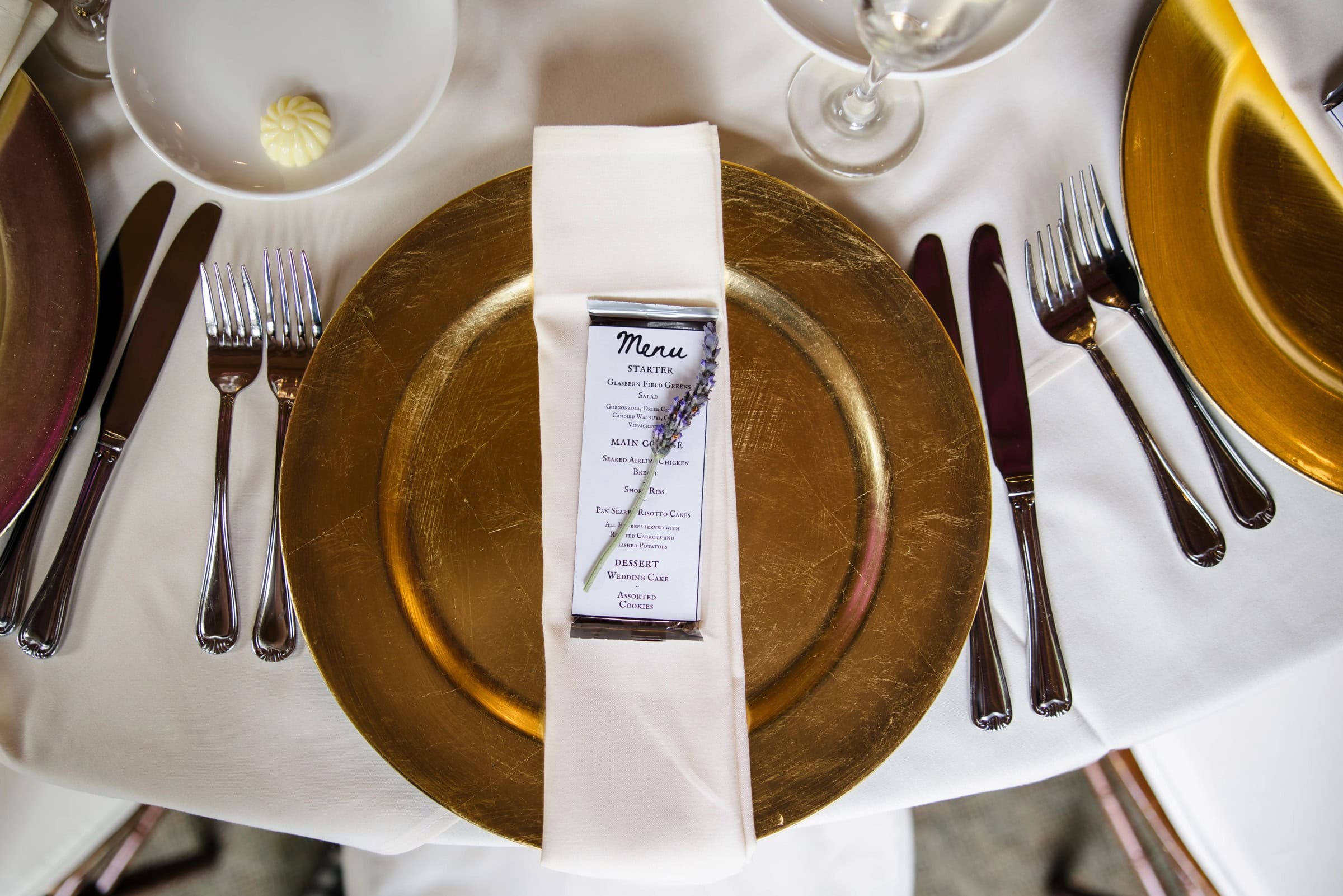 Formal place setting arranged for an elegant dinner service with menu card displayed. — Wedding at Glasbern Inn, Fogelsville, PA