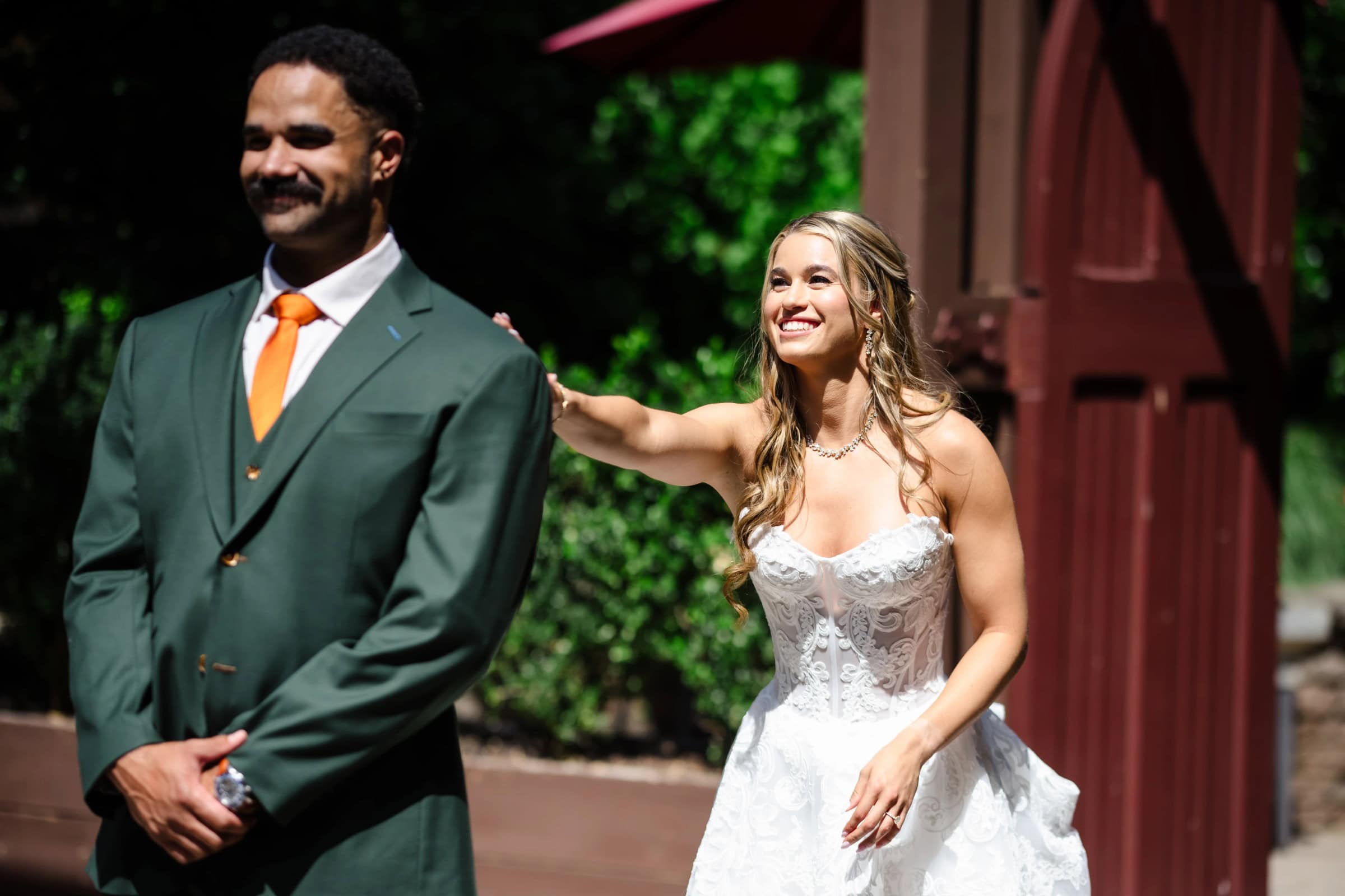 Bride and groom walking together outdoors, bride's hand on groom's arm, both smiling. &mdash; Wedding at Landmark Tavern at Stonehouse, Warren, NJ