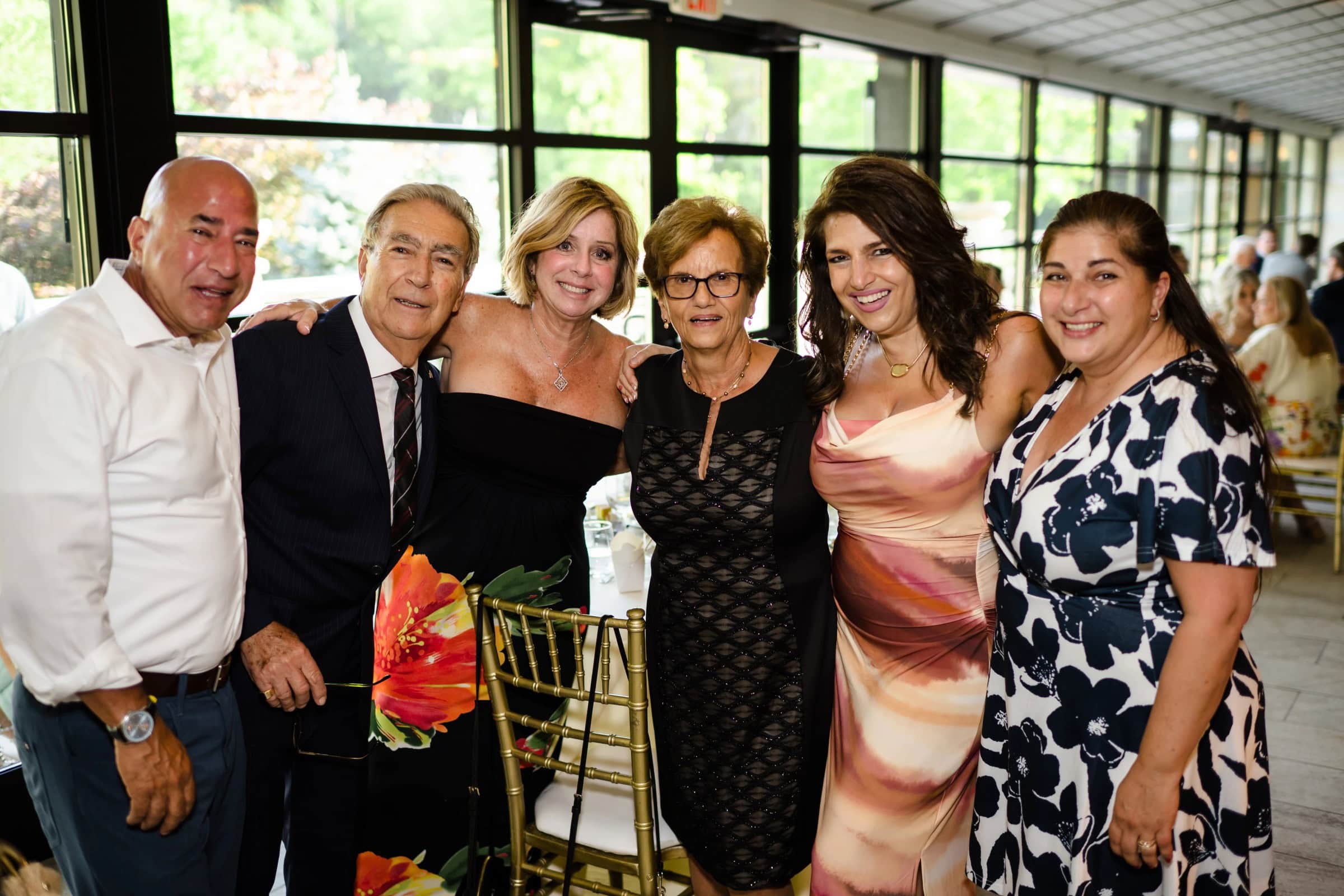 Six people posing together for a formal group photograph at an event. &mdash; Wedding at Landmark Tavern at Stonehouse, Warren, NJ